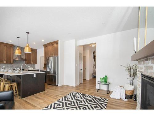 140 Emerald Drive, Red Deer, AB - Indoor Photo Showing Kitchen With Fireplace With Stainless Steel Kitchen With Upgraded Kitchen