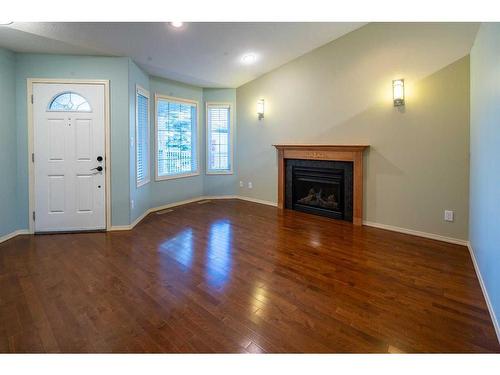 23 Victor Close, Red Deer, AB - Indoor Photo Showing Other Room With Fireplace