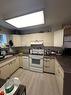 5007/5009 53 Street, Rocky Mountain House, AB  - Indoor Photo Showing Kitchen 