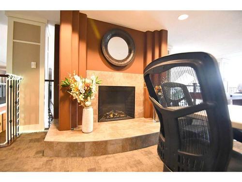 425-6 Michener Boulevard, Red Deer, AB - Indoor With Fireplace