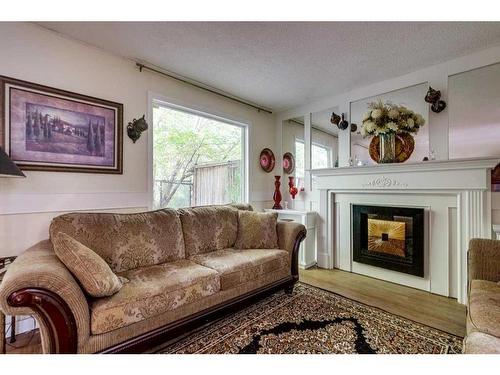 10-5806 61 Street, Red Deer, AB - Indoor Photo Showing Living Room With Fireplace