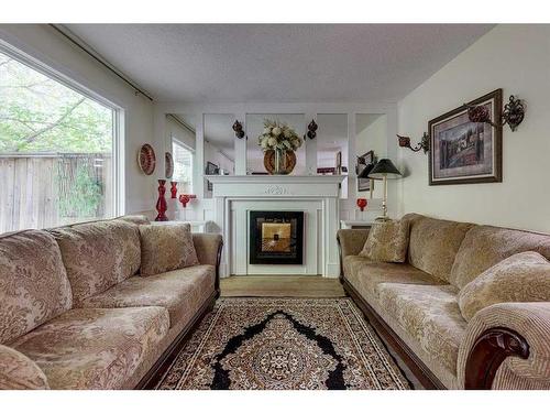 10-5806 61 Street, Red Deer, AB - Indoor Photo Showing Living Room With Fireplace