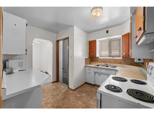 5007 56 Street, Camrose, AB - Indoor Photo Showing Kitchen With Double Sink