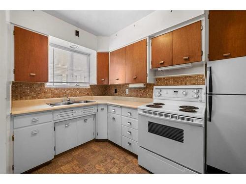 5007 56 Street, Camrose, AB - Indoor Photo Showing Kitchen With Double Sink