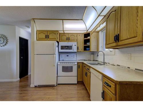 48 Nash Street, Red Deer, AB - Indoor Photo Showing Kitchen With Double Sink