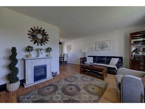 48 Nash Street, Red Deer, AB - Indoor Photo Showing Living Room With Fireplace