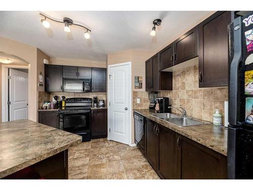 815-31 Jamieson Avenue, Red Deer, AB - Indoor Photo Showing Kitchen With Double Sink