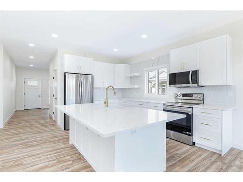 40 Erica Drive, Lacombe, AB - Indoor Photo Showing Kitchen With Upgraded Kitchen