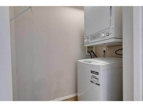 1504-1111 6 Avenue Sw, Calgary, AB - Indoor Photo Showing Laundry Room