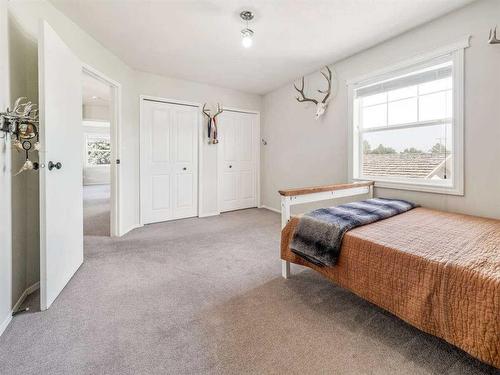 205 South 150 Street West, Raymond, AB - Indoor Photo Showing Bedroom