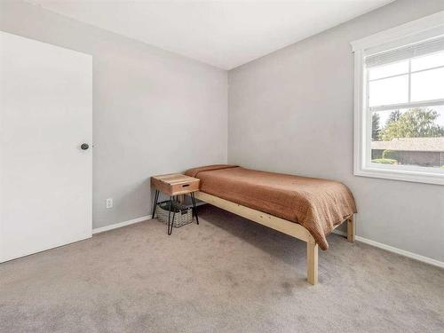 205 South 150 Street West, Raymond, AB - Indoor Photo Showing Bedroom