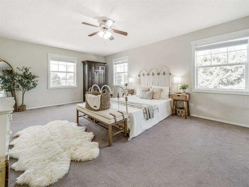 205 South 150 Street West, Raymond, AB - Indoor Photo Showing Bedroom