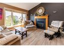 134 Issard Close, Red Deer, AB  - Indoor Photo Showing Living Room With Fireplace 