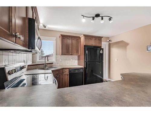 72 Ibbotson Close, Red Deer, AB - Indoor Photo Showing Kitchen With Double Sink