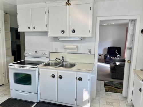 4820 46 Street, Rocky Mountain House, AB - Indoor Photo Showing Kitchen With Double Sink