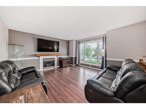 85 Herder Drive, Sylvan Lake, AB - Indoor Photo Showing Living Room With Fireplace