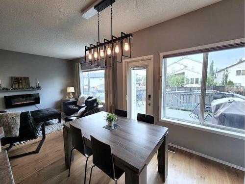 22 Jewell Street, Red Deer, AB - Indoor Photo Showing Dining Room With Fireplace