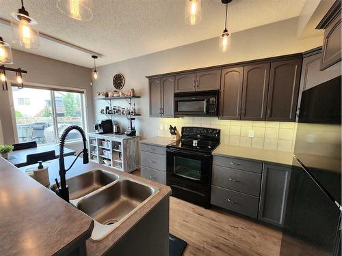 22 Jewell Street, Red Deer, AB - Indoor Photo Showing Kitchen With Double Sink