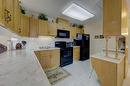 307-4614 47A Avenue, Red Deer, AB  - Indoor Photo Showing Kitchen With Double Sink 