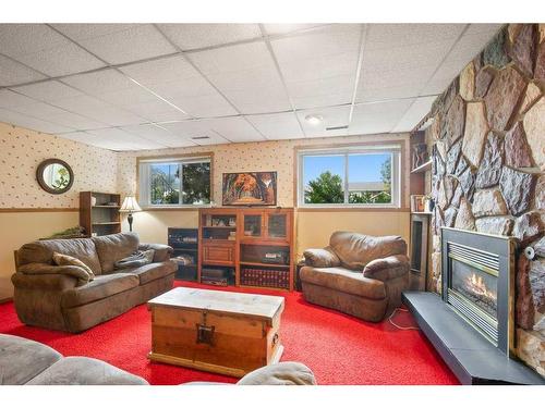 6121 Hamilton Drive, Red Deer, AB - Indoor Photo Showing Living Room With Fireplace