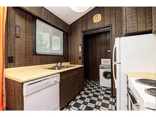 106-36078 Range Road 245A, Rural Red Deer County, AB - Indoor Photo Showing Kitchen With Double Sink