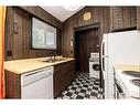 106-36078 Range Road 245A, Rural Red Deer County, AB  - Indoor Photo Showing Kitchen With Double Sink 