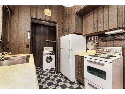 106-36078 Range Road 245A, Rural Red Deer County, AB - Indoor Photo Showing Kitchen With Double Sink