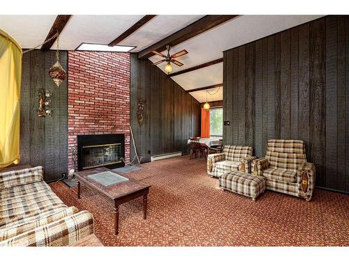 106-36078 Range Road 245A, Rural Red Deer County, AB - Indoor Photo Showing Other Room With Fireplace