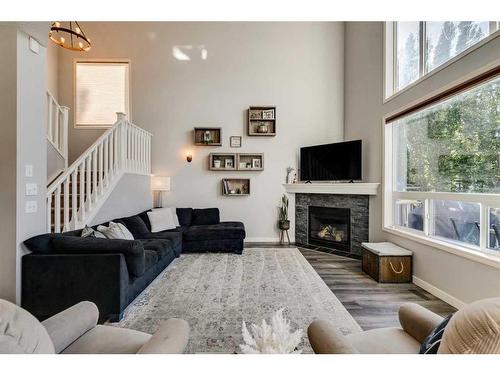 21 Morningside Bay Sw, Airdrie, AB - Indoor Photo Showing Living Room With Fireplace