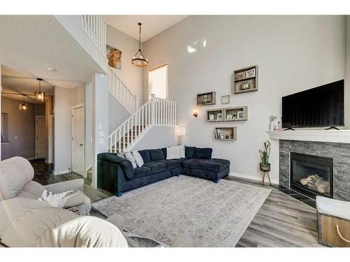 21 Morningside Bay Sw, Airdrie, AB - Indoor Photo Showing Living Room With Fireplace