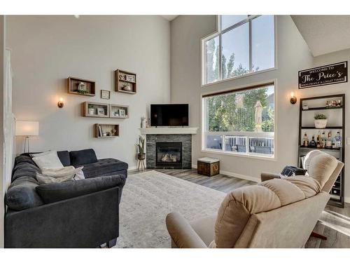 21 Morningside Bay Sw, Airdrie, AB - Indoor Photo Showing Living Room With Fireplace