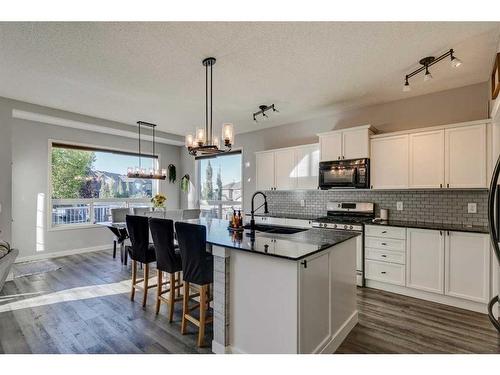 21 Morningside Bay Sw, Airdrie, AB - Indoor Photo Showing Kitchen With Upgraded Kitchen