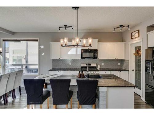 21 Morningside Bay Sw, Airdrie, AB - Indoor Photo Showing Kitchen With Upgraded Kitchen