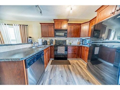 157 Kentwood Drive, Red Deer, AB - Indoor Photo Showing Kitchen With Double Sink