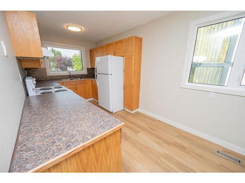 25 Abbott Close, Red Deer, AB - Indoor Photo Showing Kitchen With Double Sink