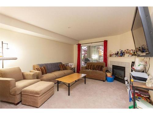 1218-12A Ironside Street, Red Deer, AB - Indoor Photo Showing Living Room With Fireplace