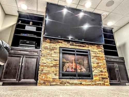 916 7 Avenue Se, Slave Lake, AB - Indoor Photo Showing Other Room With Fireplace