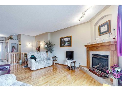 127 Lougheed Close, Red Deer, AB - Indoor Photo Showing Living Room With Fireplace