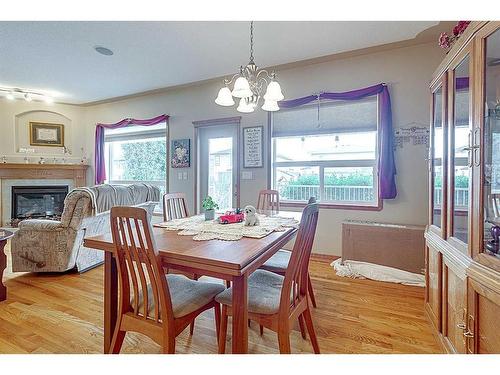 127 Lougheed Close, Red Deer, AB - Indoor Photo Showing Dining Room With Fireplace