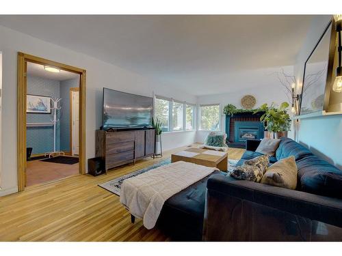 3909 50A Street, Red Deer, AB - Indoor Photo Showing Living Room With Fireplace