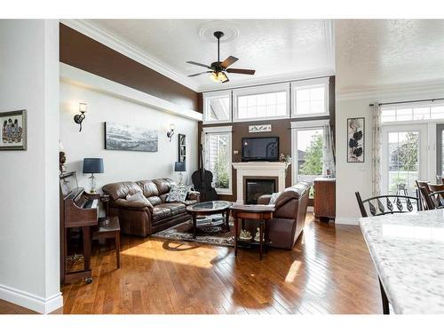 7101 Cobb Street, Lacombe, AB - Indoor Photo Showing Living Room With Fireplace