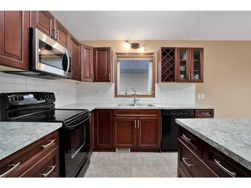 97 Kingston Drive, Red Deer, AB - Indoor Photo Showing Kitchen With Double Sink