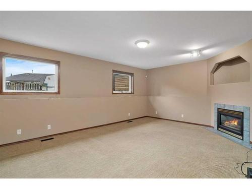 97 Kingston Drive, Red Deer, AB - Indoor Photo Showing Other Room With Fireplace