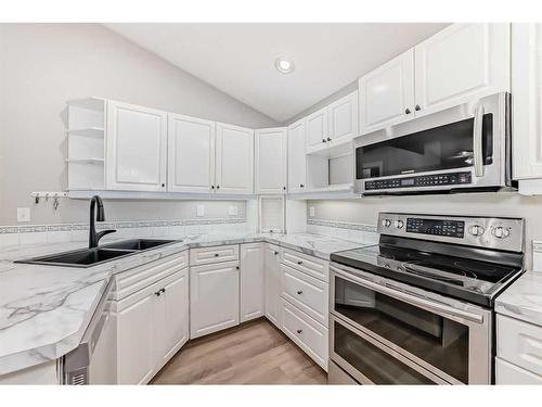 4609 44 Street, Sylvan Lake, AB - Indoor Photo Showing Kitchen With Double Sink