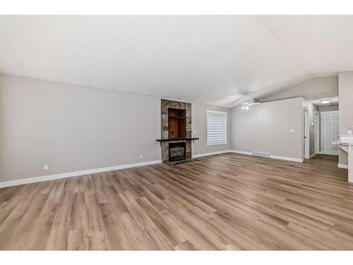 4609 44 Street, Sylvan Lake, AB - Indoor Photo Showing Living Room With Fireplace