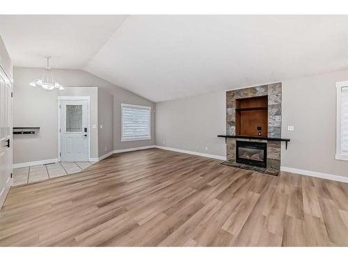 4609 44 Street, Sylvan Lake, AB - Indoor Photo Showing Living Room With Fireplace