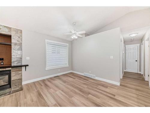 4609 44 Street, Sylvan Lake, AB - Indoor With Fireplace