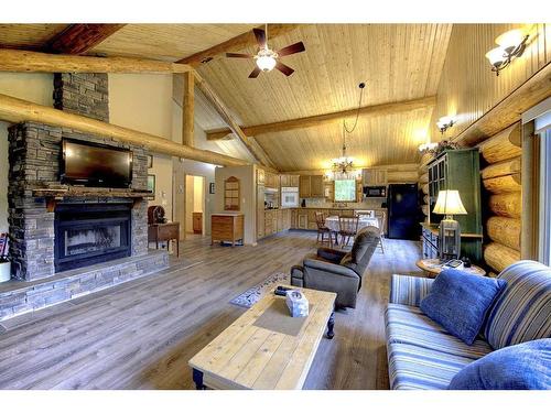 445075 Range Road 10, Rural Ponoka County, AB - Indoor Photo Showing Living Room With Fireplace