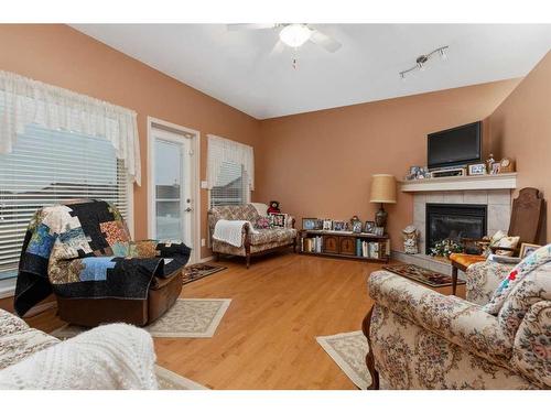 19-5405 39 Avenue, Camrose, AB - Indoor Photo Showing Living Room With Fireplace