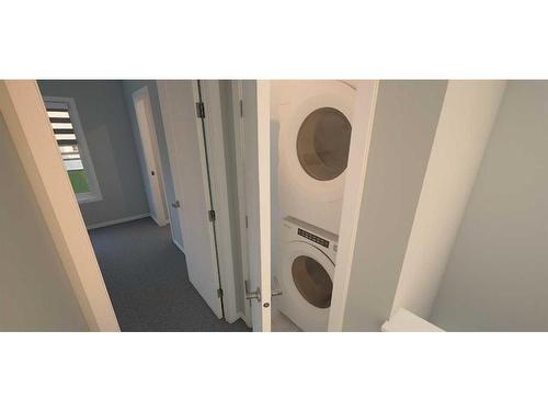 106-285 Chelsea Court, Chestermere, AB - Indoor Photo Showing Laundry Room